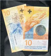  ?? AFP ?? Both sides of a 10-franc banknote.