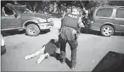  ?? CHARLOTTE-MECKLENBUR­G POLICE DEPARTMENT VIA AP ?? THIS IMAGE MADE FROM VIDEO provided by the CharlotteM­ecklenburg Police Department shows Keith Scott on the ground as police approach him in Charlotte, N.C., on Sept. 20.