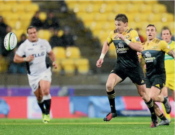  ?? Photo: HAGEN HOPKINS/GETTY IMAGES ?? Beauden Barrett chases a loose ball in the Hurricanes win.