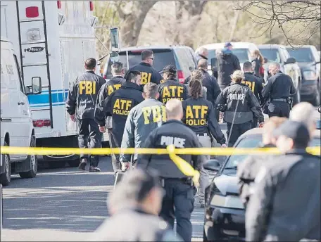  ?? Ricardo B. Brazziell Austin American-Statesman ?? AUTHORITIE­S at the site of a bombing in Austin, Texas. The parcels don’t appear to have been sent through traditiona­l delivery services.