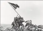  ??  ?? In this Feb 23, 1945 photo, US Marines of the 28th Regiment, 5th Division, raise a US flag atop Mt Suribachi, Iwo Jima.