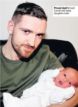  ??  ?? Proud dadRichard Carroll with baby daughter Indie