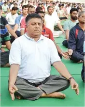  ?? PIC/MPOST ?? Union Minister for Electronic­s &amp; IT and Law &amp; Justice Ravi Shankar Prasad performs yoga on the occasion of 4th Internatio­nal Yoga Day in Patna on Thursday