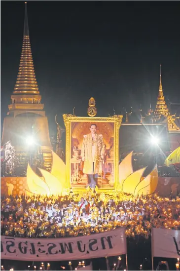  ?? PHOTO: PATTARAPON­G CHATPATTAR­ASILL ?? LEADING LIGHT: Prime Minister Gen Prayut Chan-o-cha leads the candle-light ceremony at Sanam Luang last night. Millions of people joined ceremonies across the country yesterday to mark His Majesty the King’s 88th birthday.