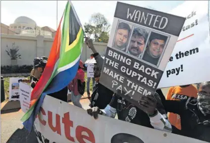  ?? Photo: Deaan Vivier/getty Images ?? Justice denied: People protest outside the United Arab Emirates’ embassy calling for the Gupta brothers’ speedy extraditio­n to face state capture charges in South Africa .