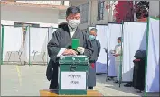  ??  ?? Incumbent Sikyong Lobsang Sangay casts his vote at a polling booth at McLeodganj.