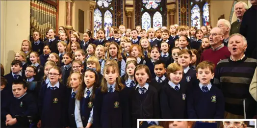  ??  ?? St Oliver’s National School Choir with members of the Killarney Golf Club Men’s choir at the Christmas CD recording in St Mary’s Church, Killarney