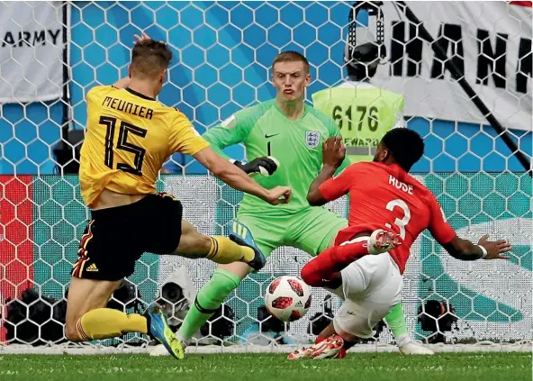  ?? AP ?? England’s Danny Rose fails to stop Belgium’s Thomas Meunier slipping the ball past goalkeeper Jordan Pickford and score Belgium’s opening goal in their 2-0 win yesterday.