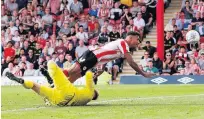  ??  ?? SPIRIT LEVEL Ollie Watkins gets horizontal to equalise