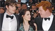  ?? JOEL RYAN/AP PHOTO ?? From left, actors Sam Riley, Kristen Stewart and Danny Morgan arrive for the screening of “On the Road” at the 65th internatio­nal film festival, in Cannes, southern France, Wednesday.