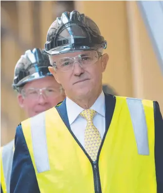  ?? Picture: ROB BLAKERS/AAP ?? Prime Minister Malcolm Turnbull visits a mill near Hobart yesterday.