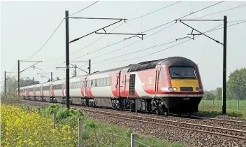  ?? ROBIN STEWARTSMITH ?? The use by LNER of HSTs on the East Coast Main Line ceased in December 2019, but earlier in the year, on May 1, power car No. 43208 leads the 09.06 King’s Cross-York past Cromwell foot crossing, north of Newark.