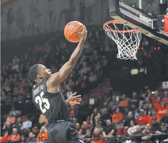  ??  ?? Colorado’s McKinley Wright scores during the first half of the No. 16-ranked Buffs’ 69-47 victory against Oregon State on Saturday night in Corvallis.
