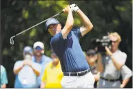  ?? Gerald Herbert / Associated Press ?? Ryan Palmer hits off the third tee during the final round of the PGA Zurich Classic on Sunday.