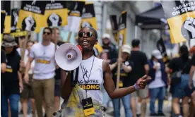  ?? Photograph: Angela Weiss/AFP/Getty Images ?? The US actor Joy Sunday joins other members of the Sag-Aftra union on the picket line outside Warner Bros in New York on Thursday.