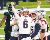  ?? Corey Sipkin Associated Press ?? NICK FOLK reacts after his winning 51- yard kick as time expires, snapping the Patriots’ four- game skid.