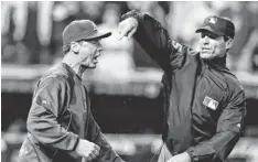  ?? MARK DUNCAN, AP ?? Managers such as the Athletics’ Bob Melvin, left, will be allowed to challenge calls under the new replay system.