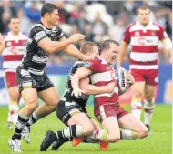  ??  ?? NOT THIS TIME Try scorer Dan Sarginson is brought down