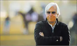  ??  ?? Trainer Bob Baffert saddles Justify and 30-1 shot Solomini in the 144th running of the Kentucky Derby on Saturday.