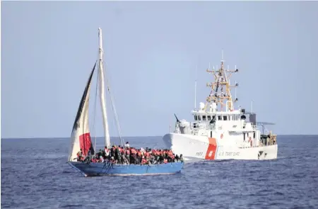  ?? ?? The Coast Guard interdicte­d this migrant boat carrying just under 300 passengers near Haiti’s coast on Jan. 26.