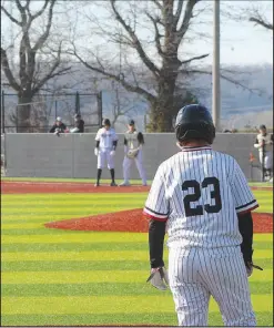  ?? Daniel Bereznicki/McDonald County Press ?? Kreighton Kasischke (No. 23) looks across the field and sees one of his teammates on first base.