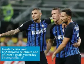  ??  ?? Icardi, Perisic and D’Ambrosio celebrate one of Inter’s goals yesterday Photograph: AP