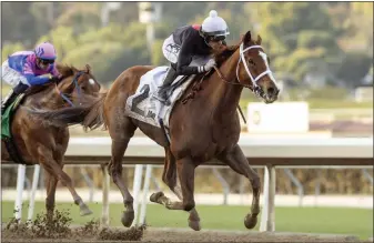  ?? BENOIT PHOTO VIA AP ?? Jockey Hector Berrios rides 6-year-old gelding The Chosen Vron, the 1-9 favorite, to a 2 1/4-length victory in the $150,000 California
Cup Sprint on Saturday at Santa Anita. The Chosen Vron has won 10 of his past 11starts.