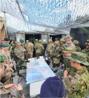  ?? PHOTOGRAPH COURTESY OF PHILIPPINE NAVY ?? Go marines Members of the Philippine Marine Corps get briefed on the activities pertaining to the Japan-United States bilateral exercise Iron Fist 2024 being held in Kyushu and Okinawa, Japan.