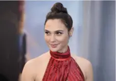  ?? JORDAN STRAUSS/INVISION/THE ASSOCIATED PRESS FILE PHOTO ?? Wonder Woman and the actor who plays her, Gal Gadot, received mass criticism on the gender front, the political front and the race front.