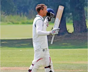  ??  ?? Jack Mynott celebrates after his magnificen­t 104