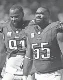  ?? ERIC HARTLINE/USA TODAY SPORTS ?? Eagles defensive tackle Fletcher Cox (91) and defensive end Brandon Graham (55) look on during a game against the Commanders at Lincoln Financial Field on Oct. 1.