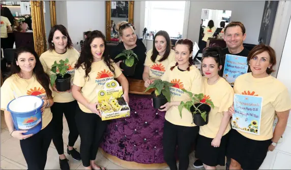  ?? Pic: ?? Staff from Rossanos, Wine Street who took part in Sun Flower Days in aid of North West Hospice last Friday. Carl Brennan.