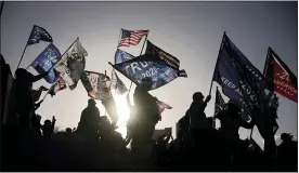  ?? ASSOCIATED PRESS FILE PHOTO ?? Supporters of President Donald Trump protest the election outside of the Clark County Election Department in North Las Vegas.