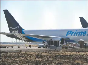  ?? BEA AHBECK/NEWS-SENTINEL ?? Airplanes distributi­ng Amazon shipments sit at Stockton Metropolit­an Airport in Stockton on Tuesday.