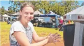  ??  ?? Laura Ayles of The Toowoomba Farmers Market uses the hand sanitising station.