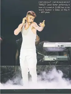  ??  ?? COPYRIGHT INFRINGEME­NT TARGET: Justin Bieber performing in front of a crowd of 15,000 fans at the Sevens Stadium in Dubai, on May 4. — AFP photo