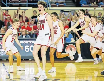  ?? [PHOTOS BY NATE BILLINGS/THE OKLAHOMAN] ?? Kingston players, including Jacob Germany (24), celebrate after beating Millwood 60-30 in the Class 3A state championsh­ip game Saturday at State Fair Arena.