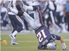  ?? ASSOCIATED PRESS FILE PHOTO ?? Patriots quarterbac­k Tom Brady flips after he was hit hard during a September 2011 game against the Chargers in Foxborough, Mass.