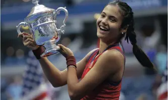  ??  ?? EMMA Raducanu of Great Britain celebrates with the championsh­ip trophy after defeating Leylah Fernandez of Canada to win the women’s final match on the thirteenth day of the US Open Tennis Championsh­ips at the USTA National Tennis Center in Flushing Meadows, New York, USA, last weekend. EPA/JOHN G. MABANGLO