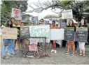  ?? Picture: SIBONGILE NGALWA ?? THIS IS NO HOME: Animal lovers gathered outside the East London Zoo on Saturday to protest the animals’ living conditions. .