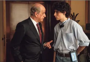  ?? Gianni Fiorito / Associated Press ?? This image released by Netflix shows Toni Servillo, left, and Filippo Scotti in a scene from “The Hand of God.”