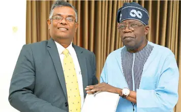  ?? ?? Indian High Commission­er to Nigeria, Gangadhara­n Balasubram­anian ( left) and All Progressiv­es Congress ( APC) presidenti­al candidate, Bola Tinubu during the envoy’s courtesy visit to the candidate in Abuja... yesterday.