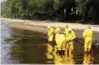  ?? Bangkok Post Photo: ?? Workers clean up the first spill on Jan 25.