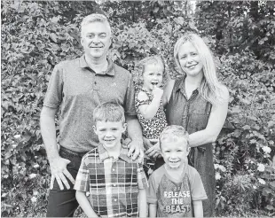  ?? ANDREJ IVANOV WATERLOO REGION RECORD ?? MPP Michael Harris, his wife Sarah, and their three children, Lincoln, Murphy, and Rosy, at their home in Kitchener. Harris plans to run for regional council.