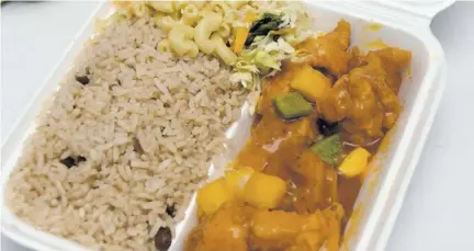  ??  ?? A large serving of sweet and sour fish with rice and peas, macaroni and tossed salads