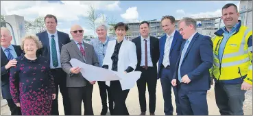 ?? (Photo: Dave Lucey) ?? Minister for Education, Norma Foley TD at the new school site in Carraig na bhFear on Friday with, l-r: Tom Howard, Carmel O’Keeffe, Paudie O’Sullivan TD, Oliver Manley, Sheila O’Callaghan, Cormac Duggan, Philip O’Brien, Colm Burke TD and James Barrett from builders, MMD Constructi­on.