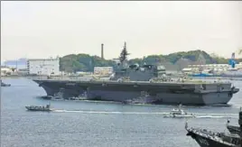  ?? AFP ?? Japanese helicopter carrier Izumo sails out of its Yokosuka Base on Monday.