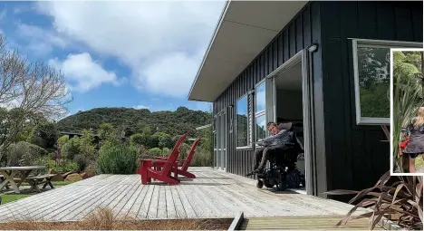  ?? Photo / Kimberly Graham ?? Left: Finlay Graham at the accessible chalet in Flaxmill Bay, Coromandel.