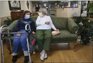  ?? JULIE BENNETT — THE ASSOCIATED PRESS ?? Carmela Sileo, left, and Susan McEachern talk Wednesday at Arbor Springs Health and Rehabilita­tion Center in Opelika, Ala. An official said none of the 115 patients there is infected with the coronaviru­s.