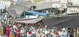  ?? —AP ?? ALLAH YUFIQUNA Lombok residents perform Friday prayer in Pamenang on Lombok Island.